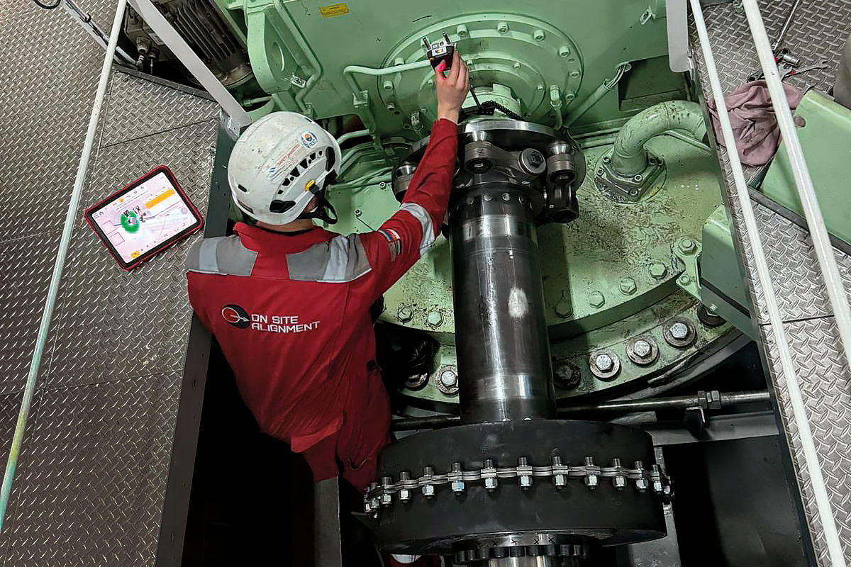 A man mounting measuring units for shaft alignment