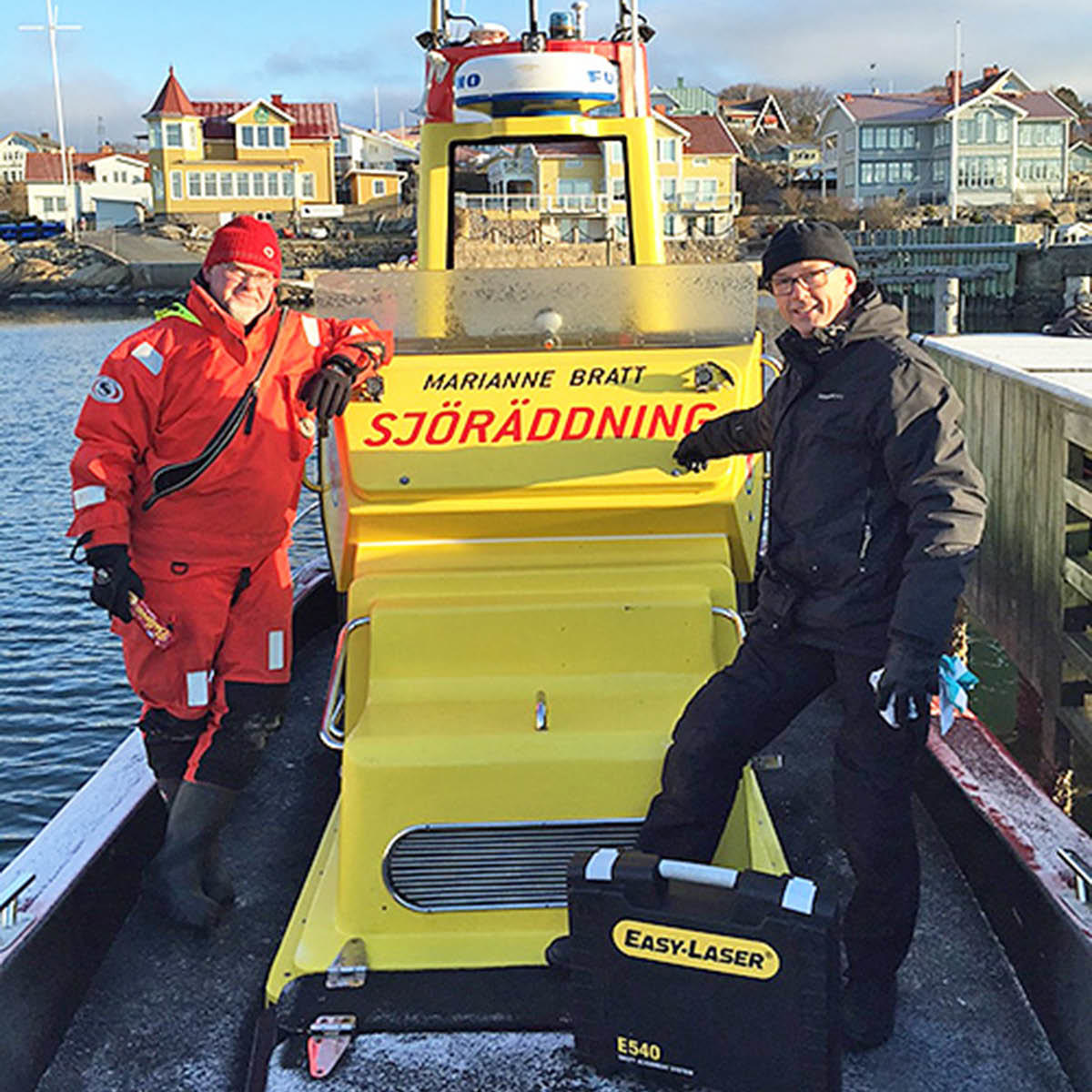 A man in life suit standing next to Jan Oscander from Easy-Laser on the SSRS boat Marianne Bratt