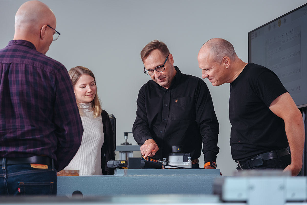 People standing around a table