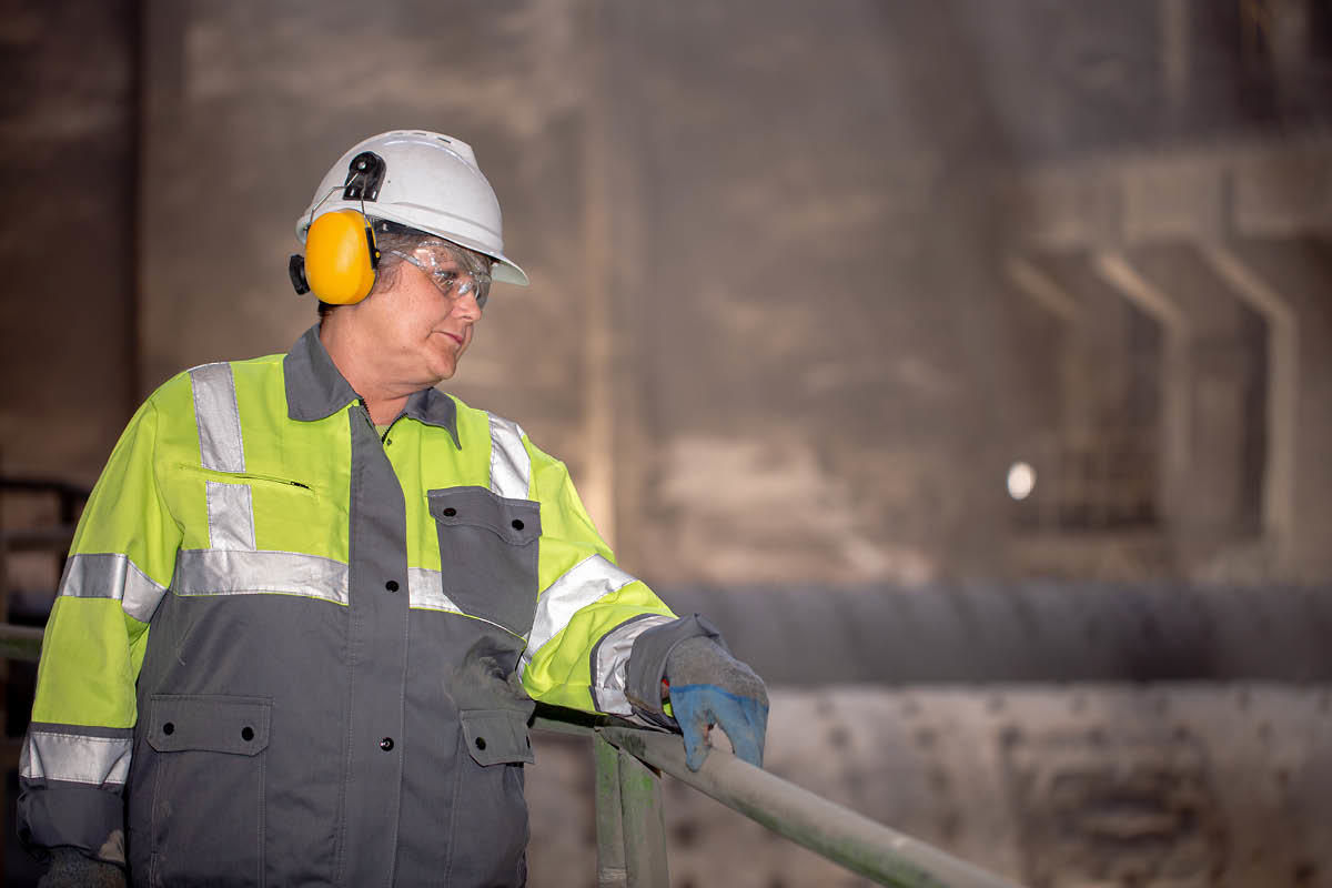 Man with helmet in dusty environment